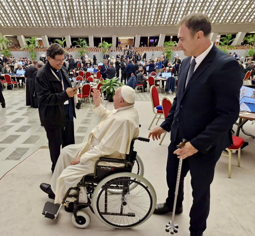 PAPAL BLESSINGS: Archbishop Charles Jason Gordon video-records Pope Francis with his cellphone as he gave a blessing to the people of TT on Thursday during the 16th Synod Assembly in Rome. The photo was posted on the Catholic Archdiocese of PoS' FB page.  - 