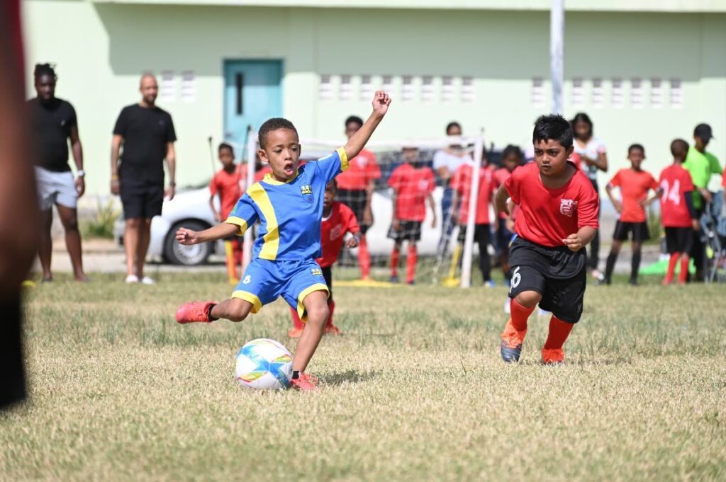 Ahzai Collins, five, plays striker, defence and right wing with Bambinos FC. Photos courtesy Sade Collins. - 