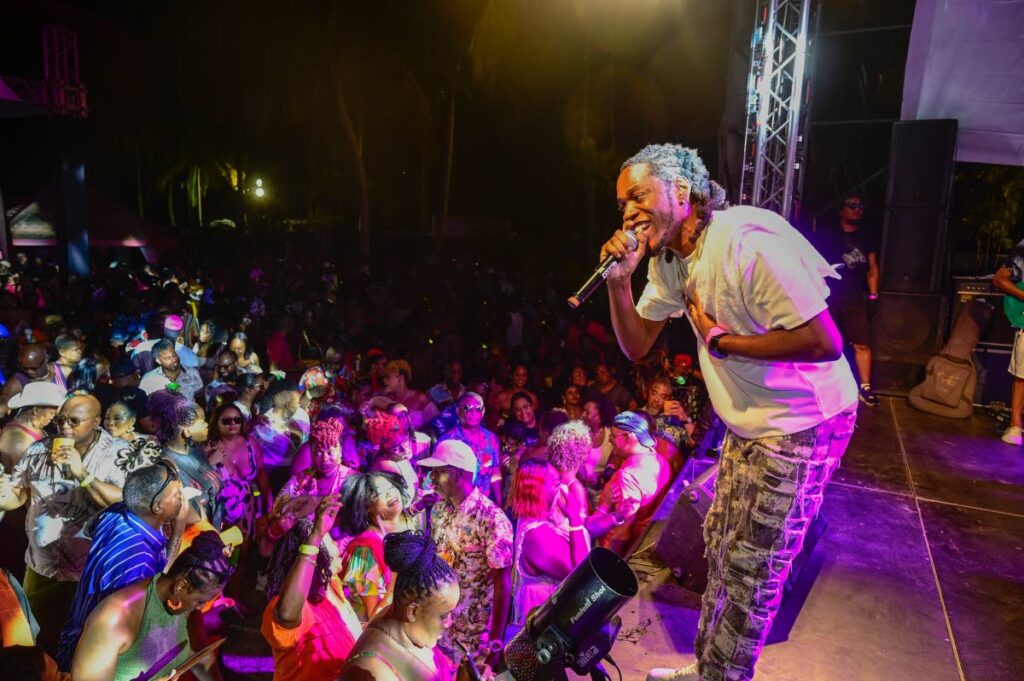 Road March winner Mical Teja performs to a packed crowd at Runaway all-inclusive fete on October 16 at Pigeon Point beach.  - Photo courtesy Visual Styles