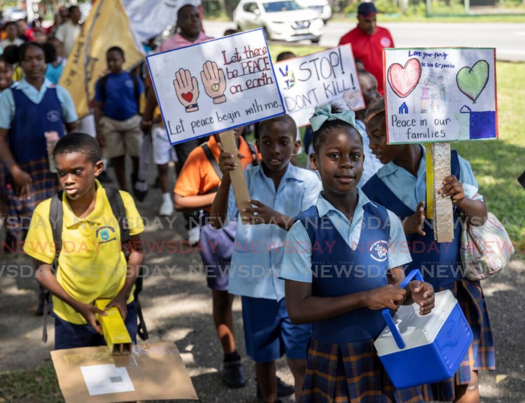 'STOP, DON'T KILL': Students of the Hokett Baptist Primary School take part in the Ministry of Education's Peace Walk at the Queen's Park Savannah, Port of Spain, on October 18. -  Photo by Jeff K. Mayers