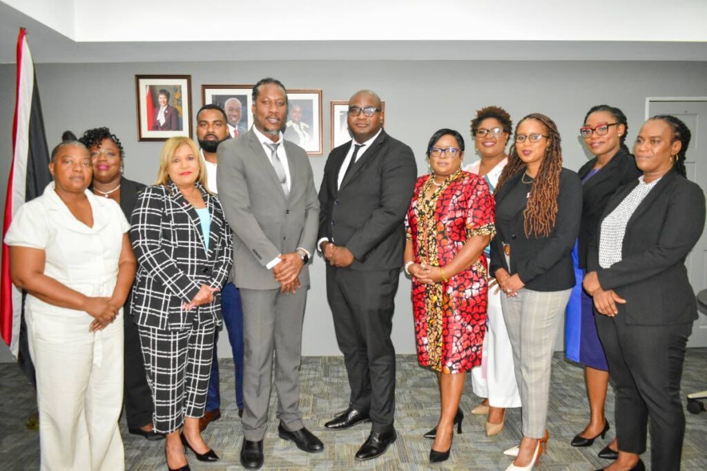 Minister in the Ministry of Housing and Urban Development Adrian Leonce, third left, with the members of the board of directors of the East Port of Spain Development Co Ltd on October 18 at the ministry on South Quay, Port of Spain. - Photo courtesy Ministry of Housing and Urban Development