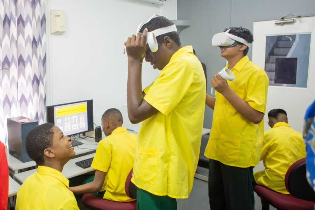 Students of the Pointe-a-Pierre Government Special School immersed in virtual reality at one of the Digicel Foundation’s first Innovation Labs, installed in 2022. - 