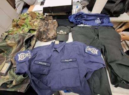 Eastern Division cops found these items, including police gear and a gun at a house in Guayaguayare on October 21. - Courtesy TTPS 