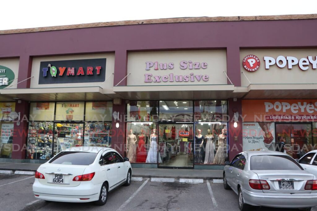 Plus Size Exclusive clothing store, Price Plaza, Chaguanas reopened for business on Wednesday, a day after two bandits dressed as schoolboys robbed the store of $80,000 in cash and other valuables on October 22.  - Photo by Angelo Marcelle