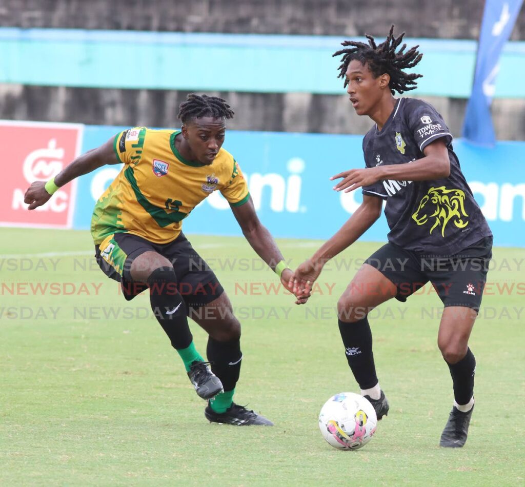 Presentation College San Fernando’s Vaughn Clement (R) controls the ball as St Benedict’s College’s Lyshaun Morris defends during their SSFL premiership division match, on October 23, 2024 at the Manny Ramjohn Stadium, Marabella. - Photo by Angelo Marcelle