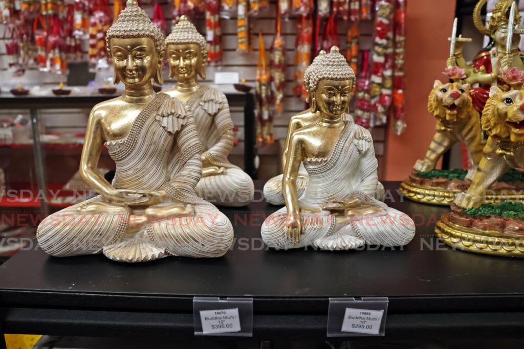 Some of the murtis on sale at the Satya Bhavan Puja and Variety Store, Chaguanas. - Photo by Lincoln Holder 