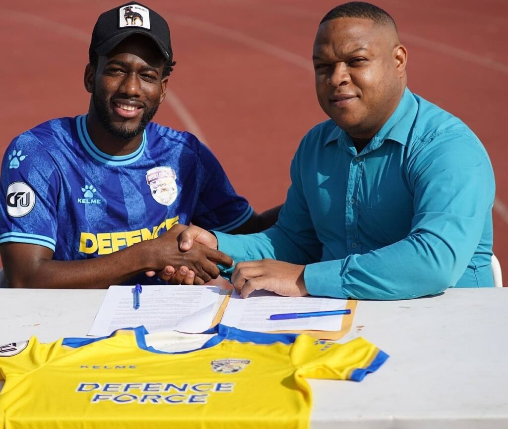 New Defence Force signing Kevin Molino, left, and Defence Force club director, Flight Lieutenant Ryan Ottley. Photo courtesy Defence Force Instagram account.  - 