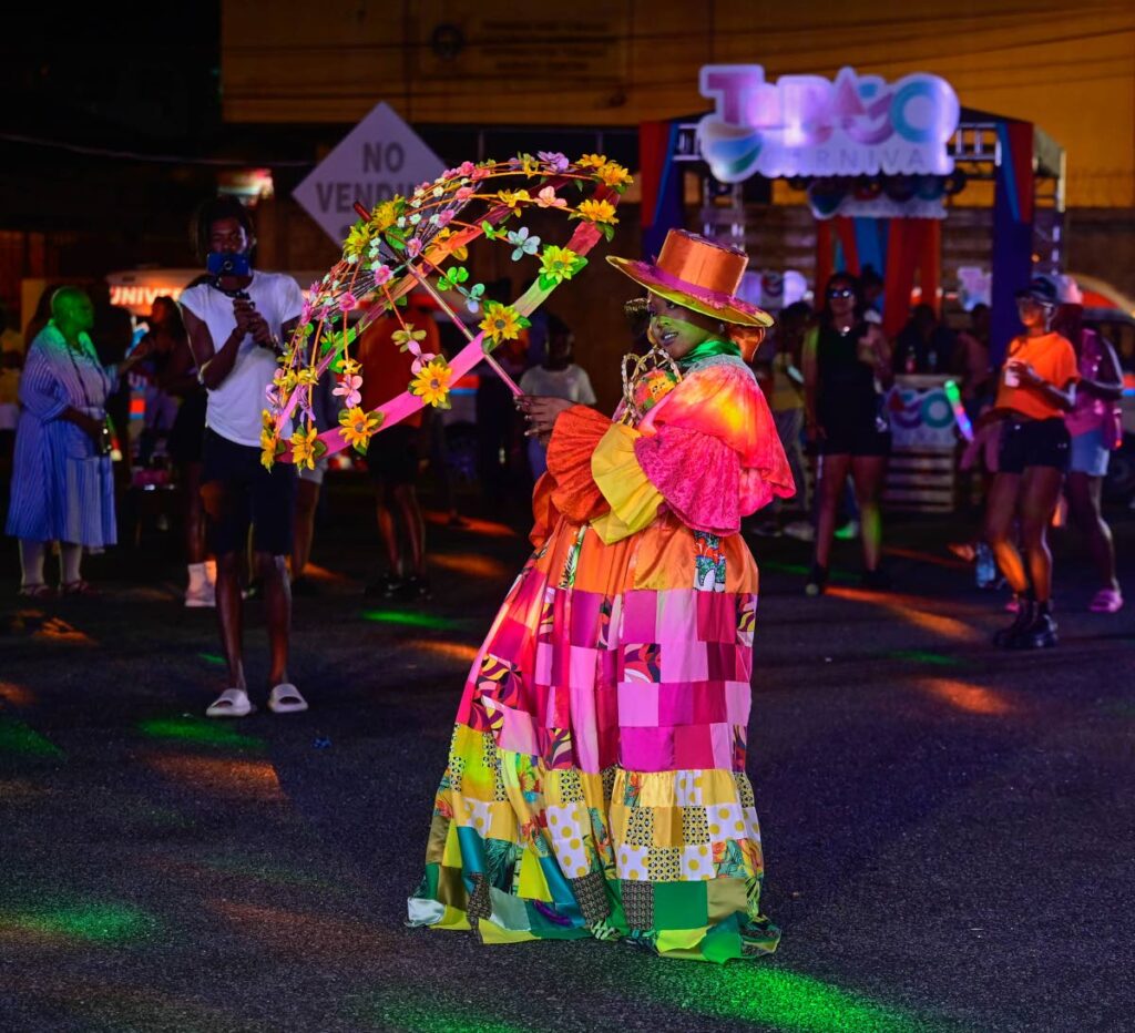 First place winner Lorraine, a dame Lorainne, portrayed  by Shurnecia Walker at the Monarchs of Mas competition at Market Square, Scarborough, Tobago on October 25. - Visual Styles