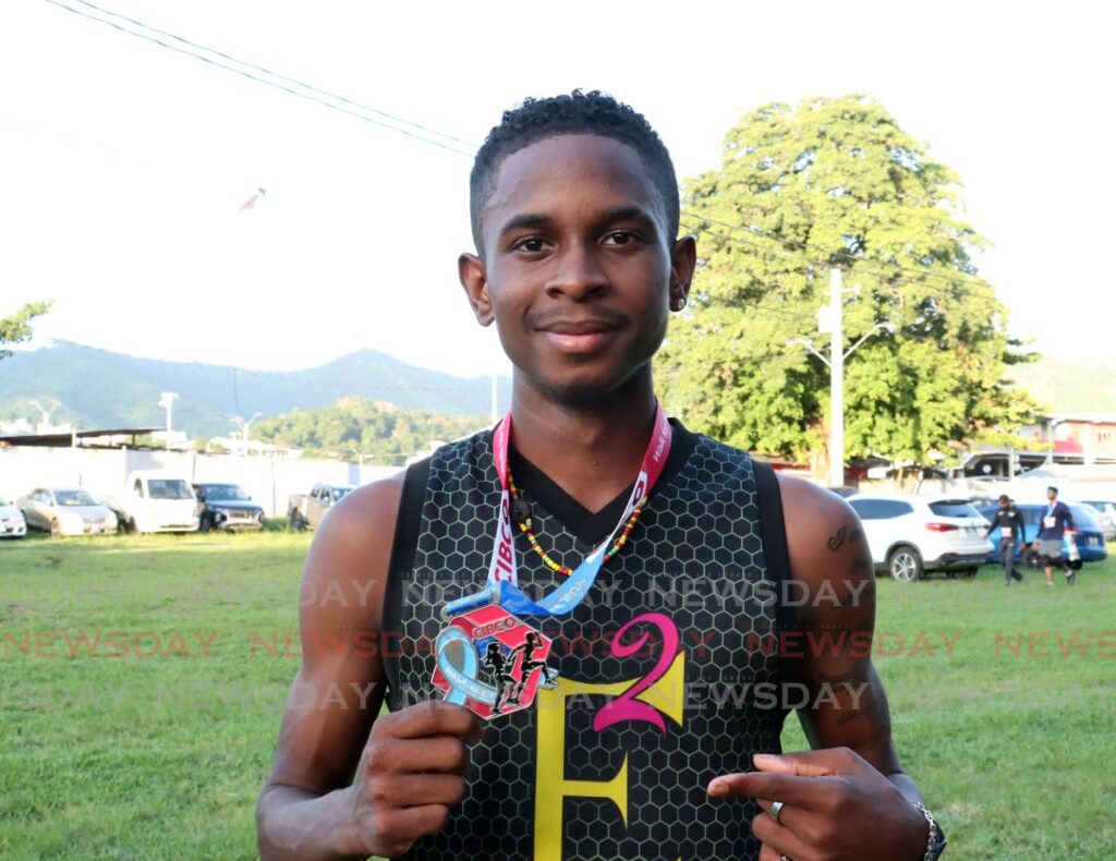 Tafari Waldron celebrates after winning the Canadian Imperial Bank of Commerce Caribbean Walk for the Cure and 5K at the Queen’s Park Savannah, Port of Spain on October 26, 2024. - Photo by Faith Ayoung