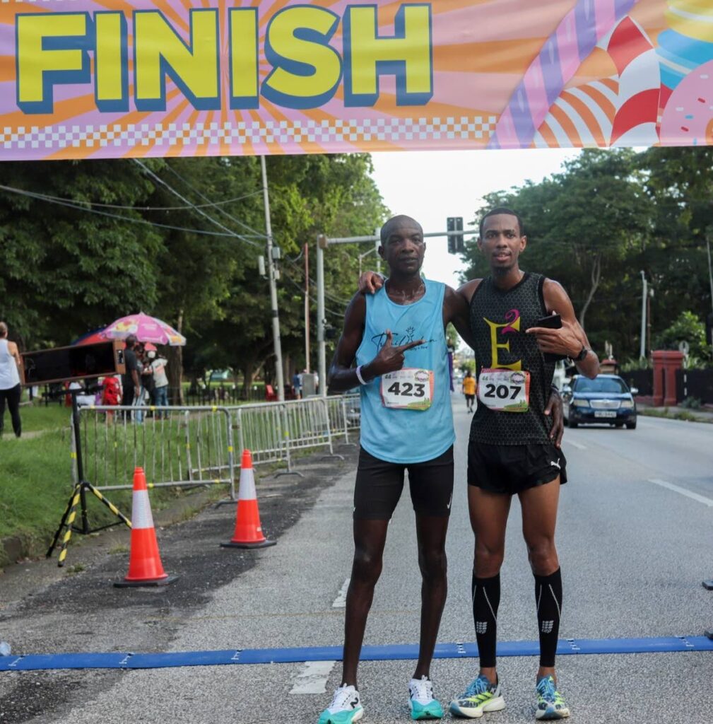 First-place finisher Nicholas Romany (right) and runner-up Alex Ekesa share an embrace after the Race to End Childhood Obesity in Trinidad and Tobago's inaugural Sugar Rush 5K in PoS on October 26, 2024. Photo courtesy Runners Life.  - 