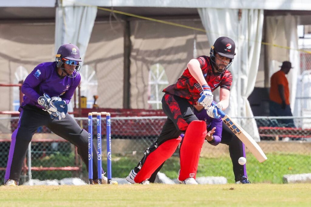 Red Force Kjorn Ottley (R) plays a shot into the leg side against CCC during the CWI Super 50 tournament at UWI SPEC on October 29, in St Augustine. Ottley made 45 runs off 89 balls. - DANIEL PRENTICE