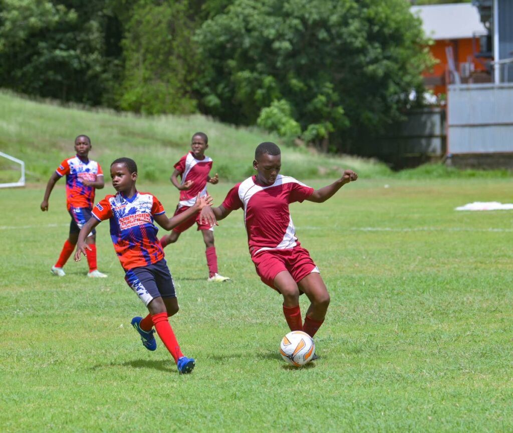 Moriah (in red) defeated Speyside Primary School 2-0 at the Jubliee ground Scarborough, on October 29. - Visual Styles