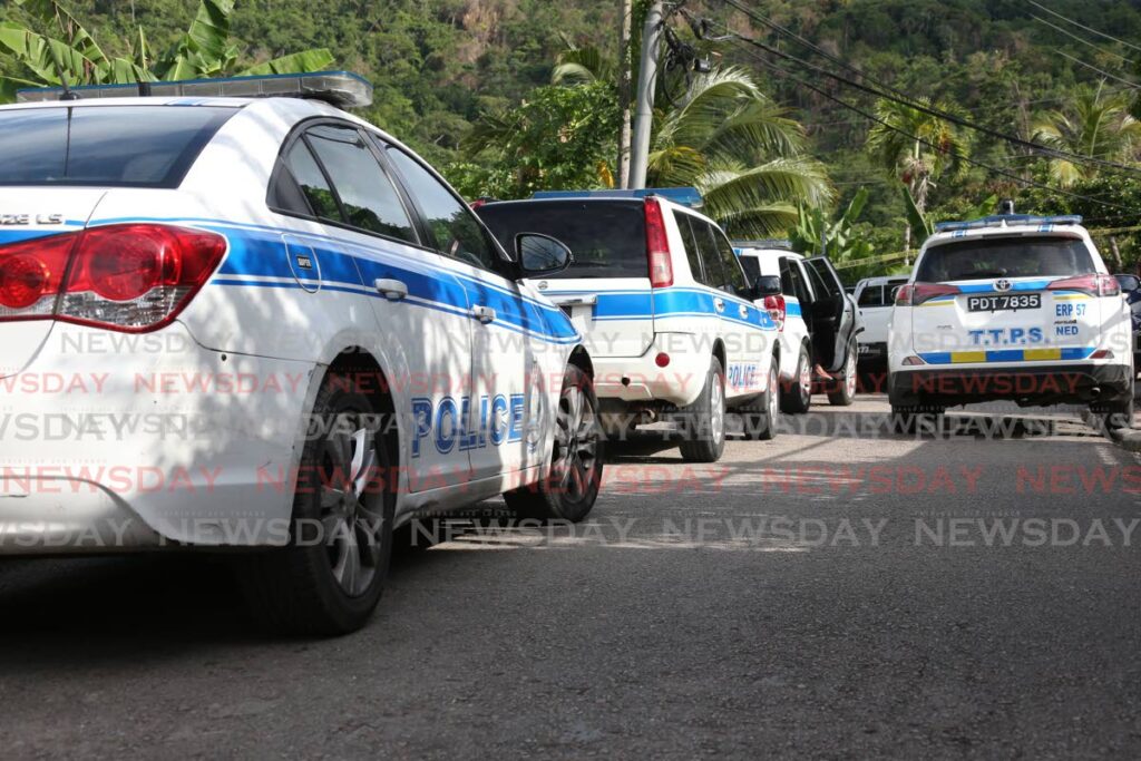 Police at a murder scene.  - File photo by Jeff K Mayers