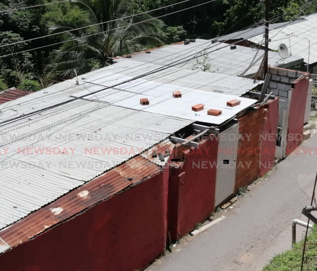 The entrance to Dibe Road, near where a police manhunt is now on for a man who abducted a 12-year-old boy after stabbing the child's mother. - Photo by Ryan Hamilton-Davis