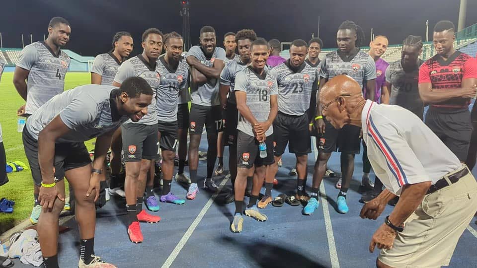 In this March 2023 file photo, former national football coach Bertille St Clair, right, gives tips to national players at a training session at the Dwight Yorke Stadium, Bacolet.  - TTFA 