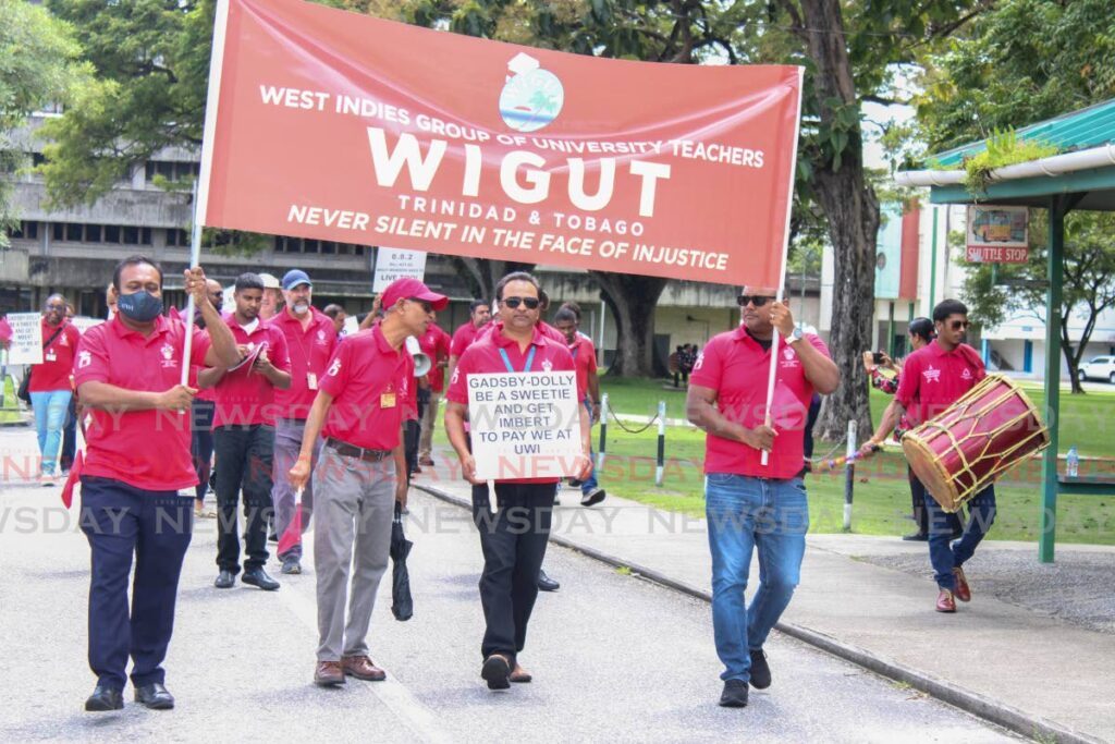 In this file photo, members of the West Indies Group of University Teachers (Wigut) during protest action at the UWI St Augustine campus demanding at settlement of their outstanding negotiations. - 