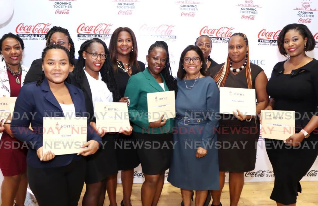 Trade Minister Paula Gopee-Scoon, centre, poses with graduates of the Coca Cola/ UWI Roytec training: Growing Together Small Businesses earlier this year. - File photo by Ayanna Kinsale