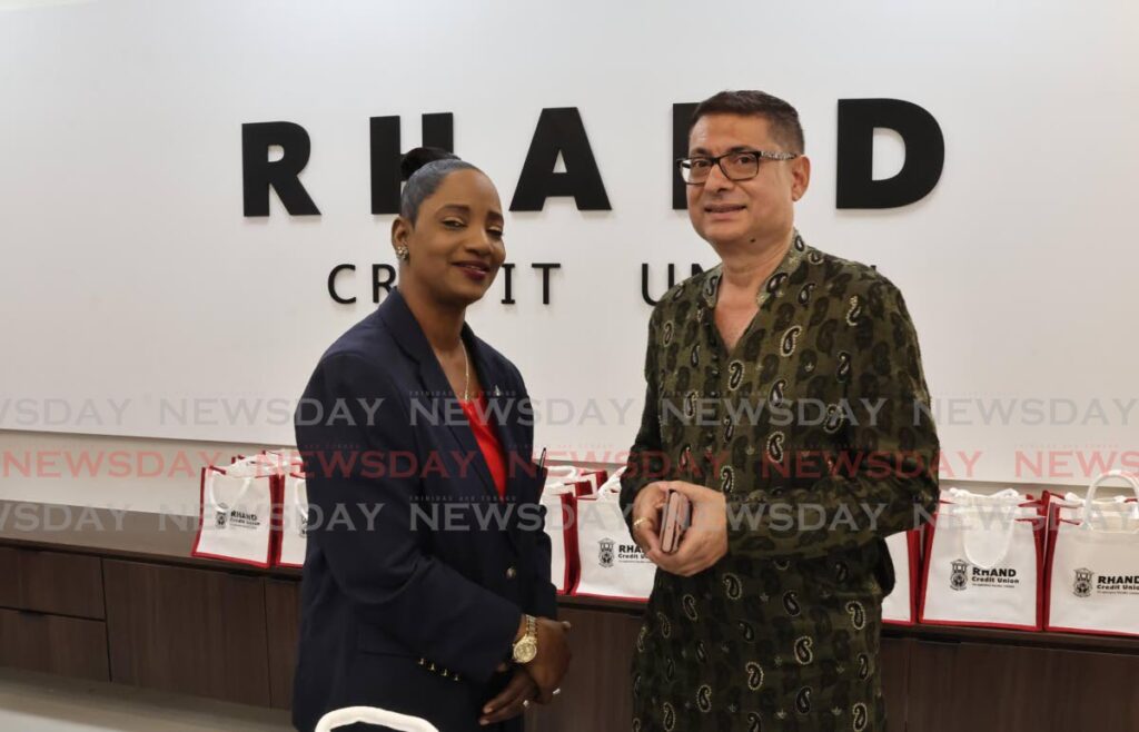 Simone Huggins, president of RHAND Credit Union and Kiran Singh, president of the Greater San Fernando Chamber of Commerce at the opening of RHAND Credit Union's San Fernando branch on October 30. - Photo by Lincoln Holder 