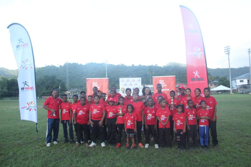 Cantaro Champions pose for a group photo with Minister of Education Dr Nyan Gadsby-Dolly at the Community Cricket Coaching Programme’s Cricket Festival on October 26. - Photo courtesy SportTT