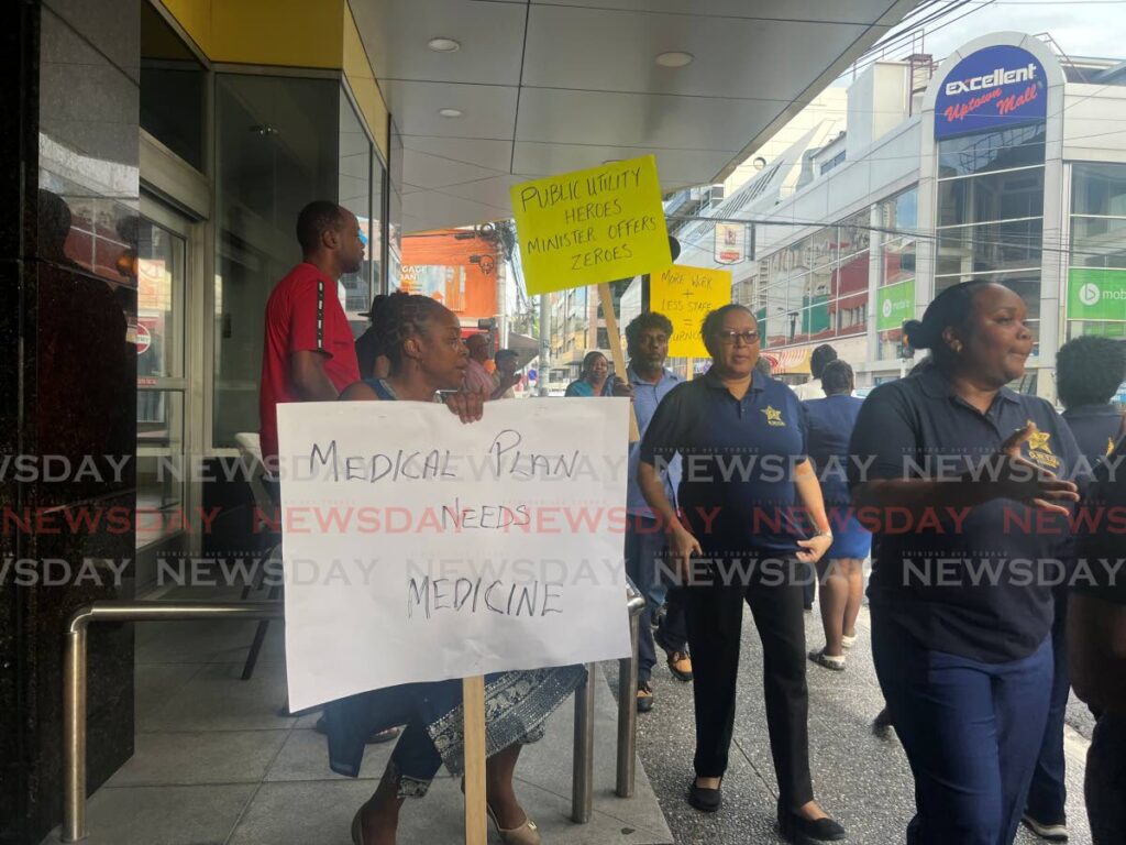 T&TEC workers protest outside the commission’s head office, at the corner of Park and Frederick streets, Port of Spain, on October 30. - Photo by Enrique Rupert