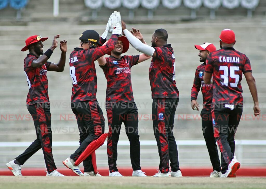 TT Red  Force players celebrate a wicket against Windward Volcanoes during the CG United Super 50 at the Brian Lara Cricket Academy, Tarouba, November 1. - Photo by Lincoln Holder 