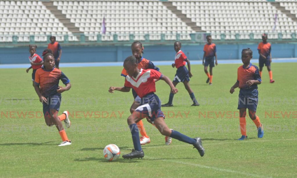 A Scarborough RC player on the ball against Signal Hill Primary School in the final of the Tobago Primary Schools Football League at the Dwight Yorke Stadium, Bacolet, November 1.  - Visual Styles 