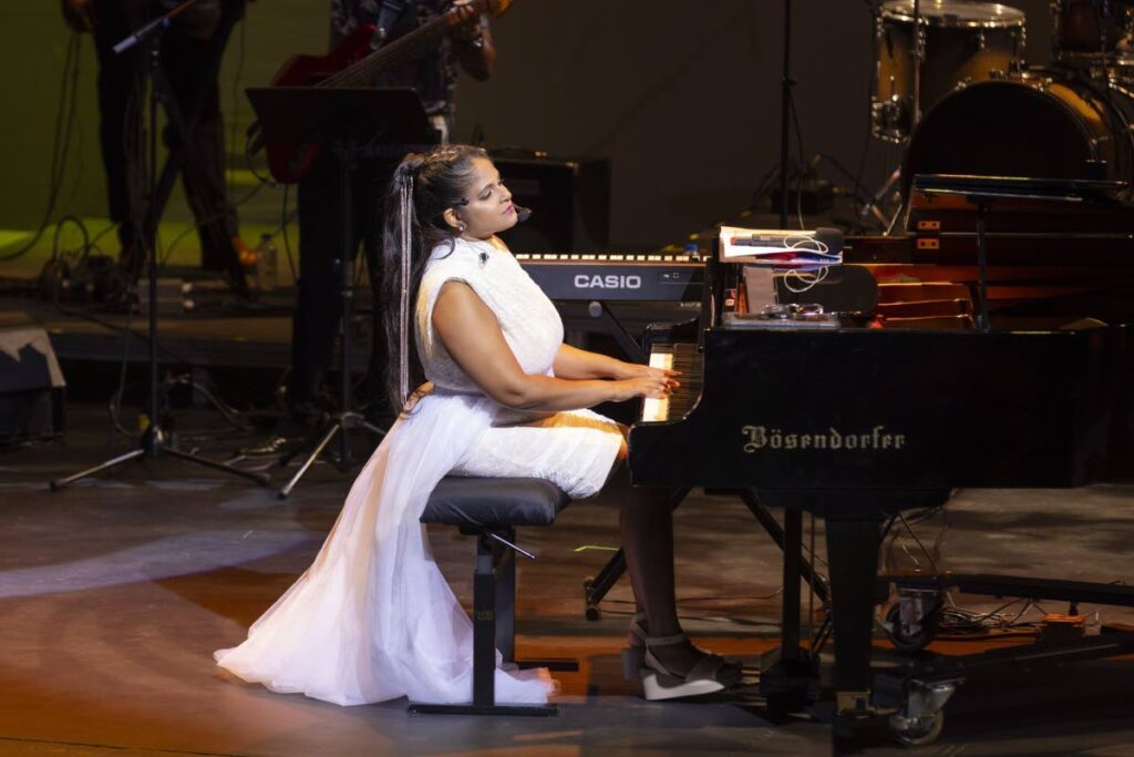 D Piano Girl Johanna (Johanna Chuckaree) performs at her concert, Evolution: The Concert Experience, at the Winifred Atwell Auditorium, Queen's Hall, St Ann's.  - Photo courtesy Damien Luk Pat 