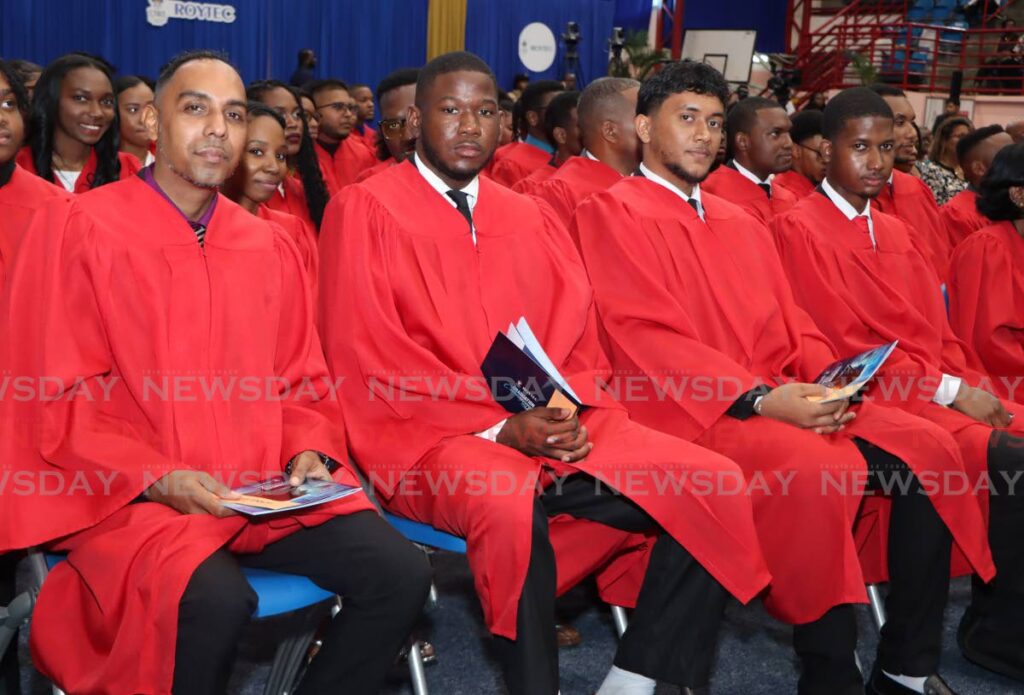 UWI-Roytec asscociate degree students, from left, Ronnie Bhabikhan, Miguel Charles, Alex Lalmansingh and Michel Samuel, at the graduation ceremony at UWI SPEC, St Augustine on November 1.  - Angelo Marcelle