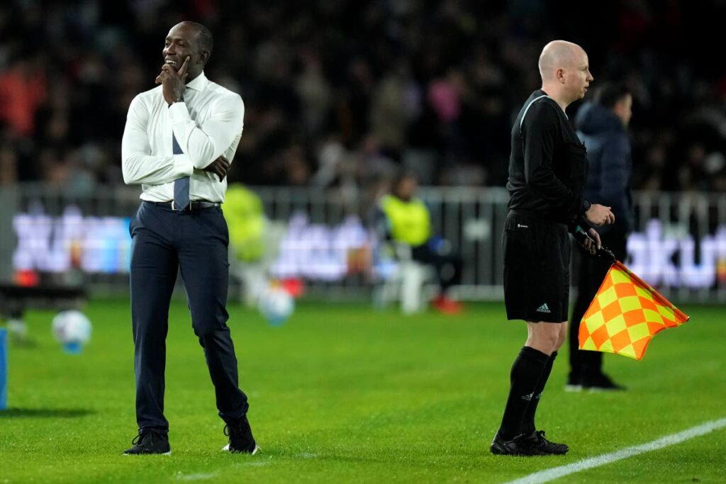 FILE PHOTO: A-Leagues All Stars' manager Dwight Yorke, left, smiles during a friendly football match against Barcelona in Sydney, Australia on May 25, 2022. AP PHOTO - AP PHOTO