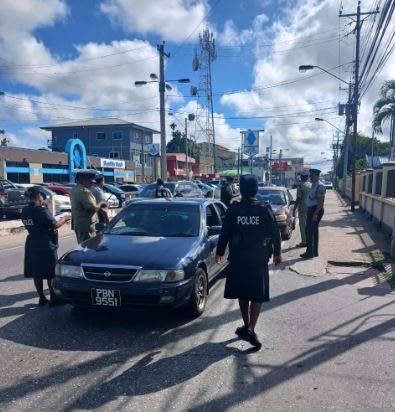 Central Division police officers conduct an anti-crime road exercise on November 4 in Couva.  - Photo courtesy TTPS