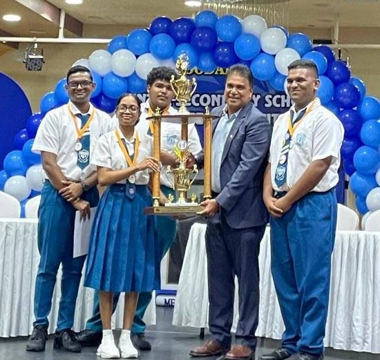 Barrackpore West Secondary School (BWSS) students with Oropouche East MP Dr Roodal Moonilal at Achievors Banquet Hall in San Fernando on November 5. BWSS won the Dr Roodal Moonilal Inter-Secondary Schools Debate Competition.  - Photo courtesy Dr Moonilal