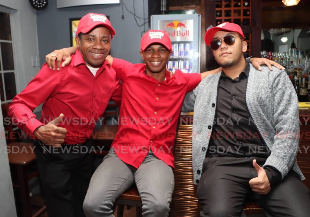 From left, Sherwin Cashie, Atiba Guerra and Scott Lee, were among those who turned up to the watch party for US presidential candidate Donald Trump at  Cipriani Boulevard, Port of Spain on November 5. - Photo by Angelo Marcelle