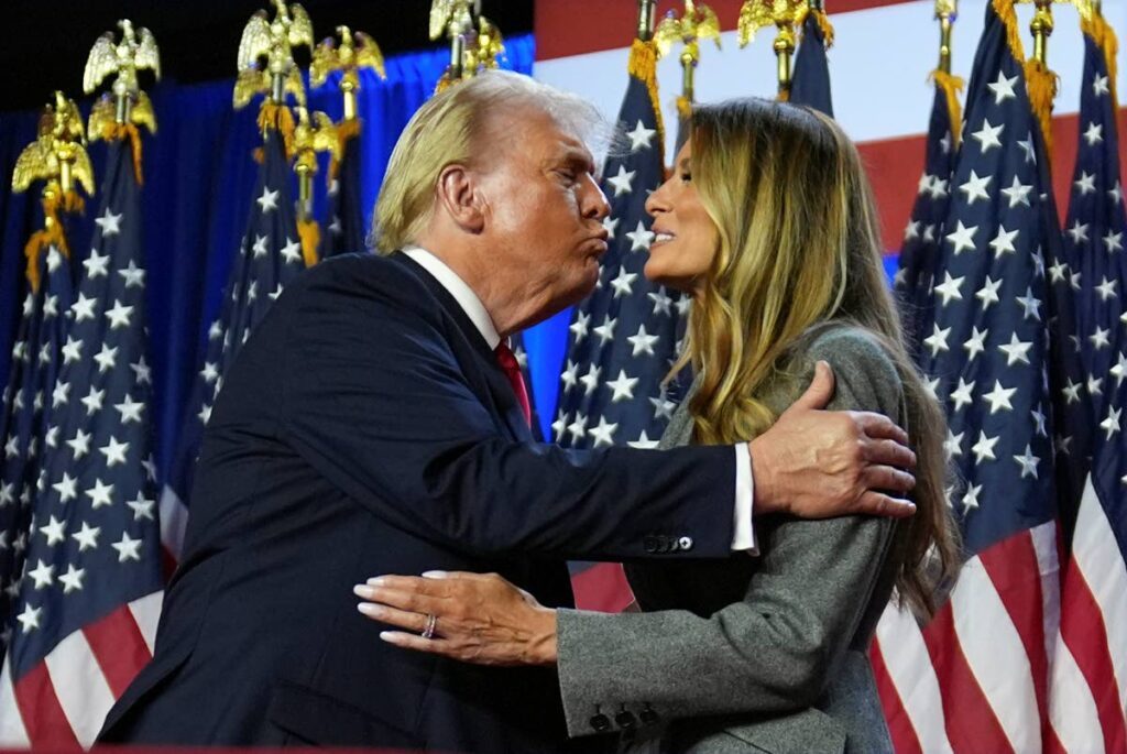 US President-elect Donald Trump kisses his wifey Melania at an election night watch party at the Palm Beach Convention Center, in West Palm Beach, Florida, on November 6. - AP PHOTO 