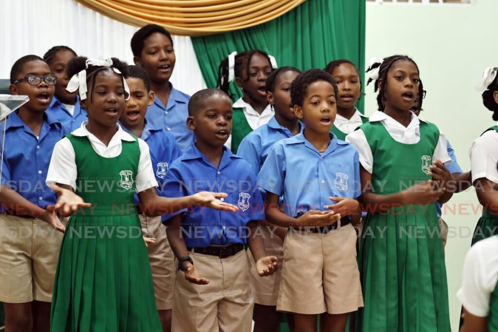 Students of the Guapo Government Primary School choir during their performance of their school's song at the school's 120th anniversary celebrations at the Point Fortin Town Hall. - Photo by Lincoln Holder 