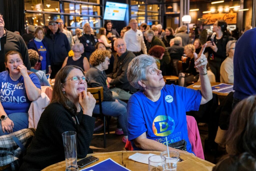 Iowa City residents follow election results at Big Grove Brewery in Iowa City, Iowa, USA on November 5. - AFP PHOTO