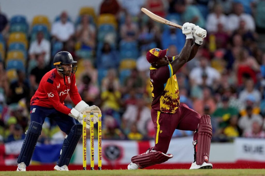 West Indies captain Rovman Powell hits a six as England's Phil Salt keeps wicket in the second T20 in Barbados on November 10.  -