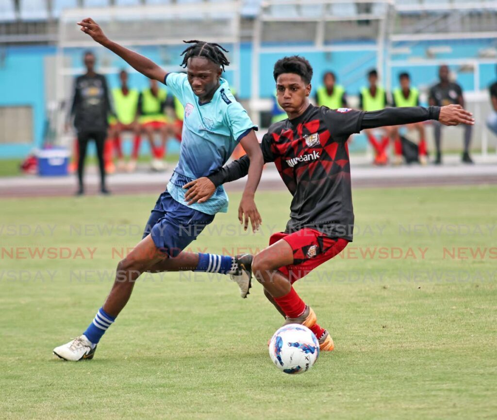 Miracle Ministries Pentecostal High School’s Kyle Holder (L) challenges Presentation College Chaguanas player Ethan Mouraf in the Coca-Cola Intercol Central zone semifinals at the Ato Boldon Stadium, on November 11, 2024. - Photo by Lincoln Holder