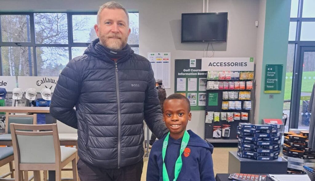 Young Tobago golfer Levi De Coteau and US Kids Golf Foundation Tournament co-ordinator, South London, Paul Ring. - 