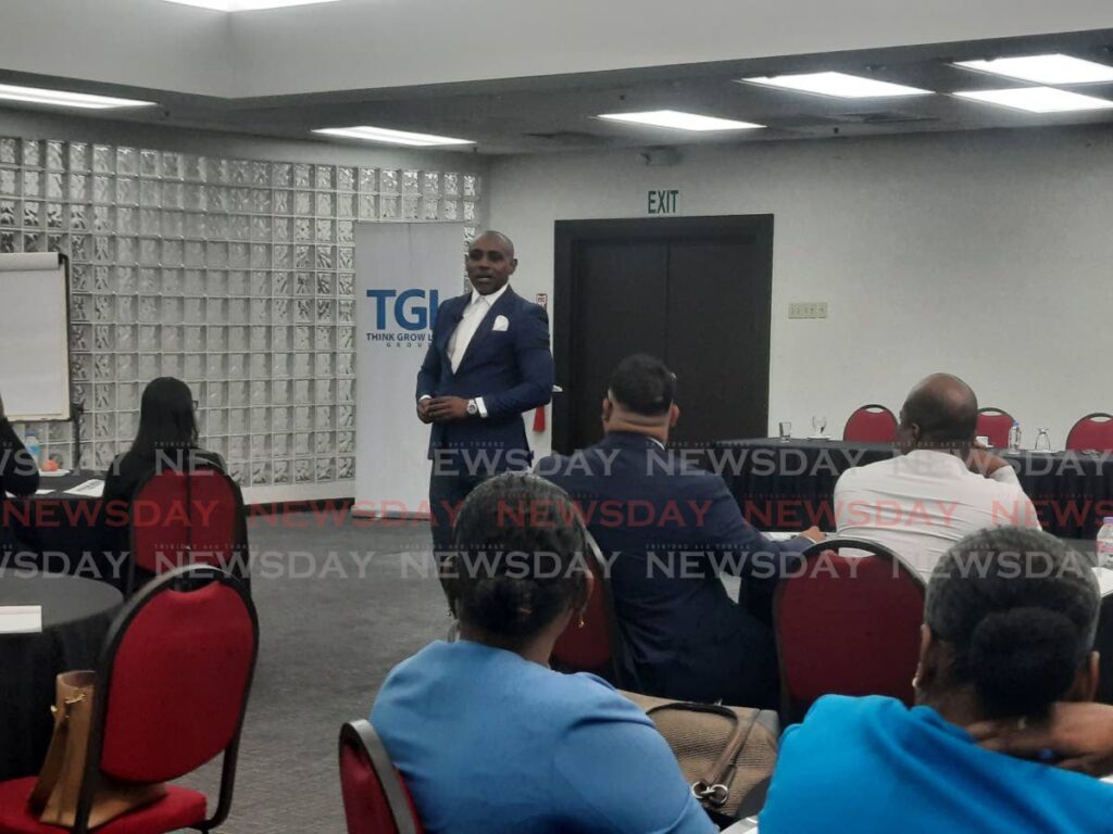 TGL Group executive chairman and co-founder Duane Lue Fung lectures a group of salespeople during its Sales Force Development and Infrastructure Workshop in collaboration with the TT Chamber of Industry and Commerce at the Chamber’s head office in Westmoorings on November 13. - Paula Lindo