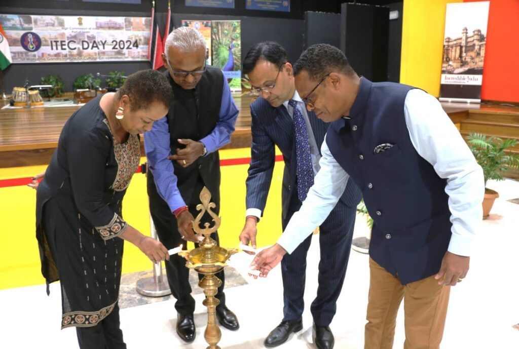 WORKING TOGETHER: From left, Public Administration Minister Allyson West, Couva South MP Rudranath Indarsingh, India's High Commissioner to TT Dr Pradeep Singh Rajpurohit and Foreign and Caricom Affairs Minister Dr Amery Browne at the High Commission's commemoration ceremony marking 60 years of the Indian Technical and Economic Cooperation (ITEC) programme at the Mahatma Gandhi Institute of Cultural Cooperation in Mt Hope on November 13. - Photo courtesy the Indian High Commission