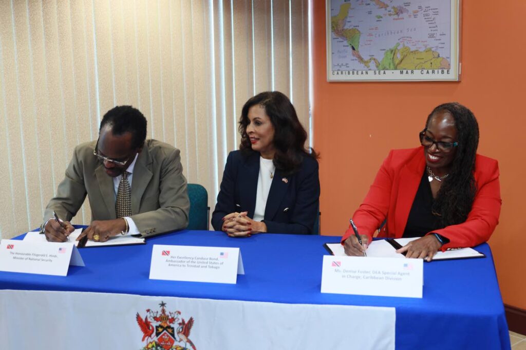 Minister of National Security Fitzgerald Hinds, United States Ambassador Candace Bond, centre, and DEA Caribbean Division Special Agent in Charge Denise Foster. - Photo courtesy US Embassy