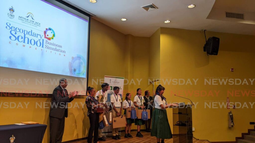 Skye Craig from Couva East Secondary School gives an acceptance speech at the Arthur Lok Jack Secondary School Business Simulation Competition award ceremony on November 15. - 