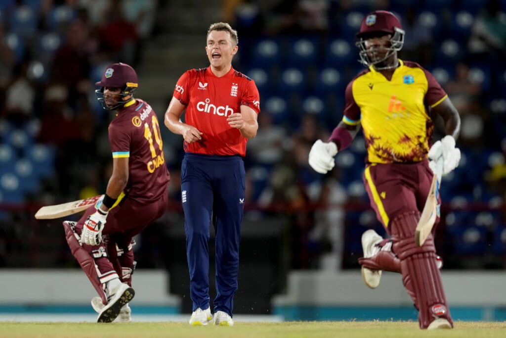 England’s bowler Sam Curran reacts as West Indies’ Sherfane Rutherford (R) and Roston Chase run during the fourth T20 match at Daren Sammy National Cricket Stadium in Gros Islet, St Lucia, on November 16, 2024. AP Photo - 