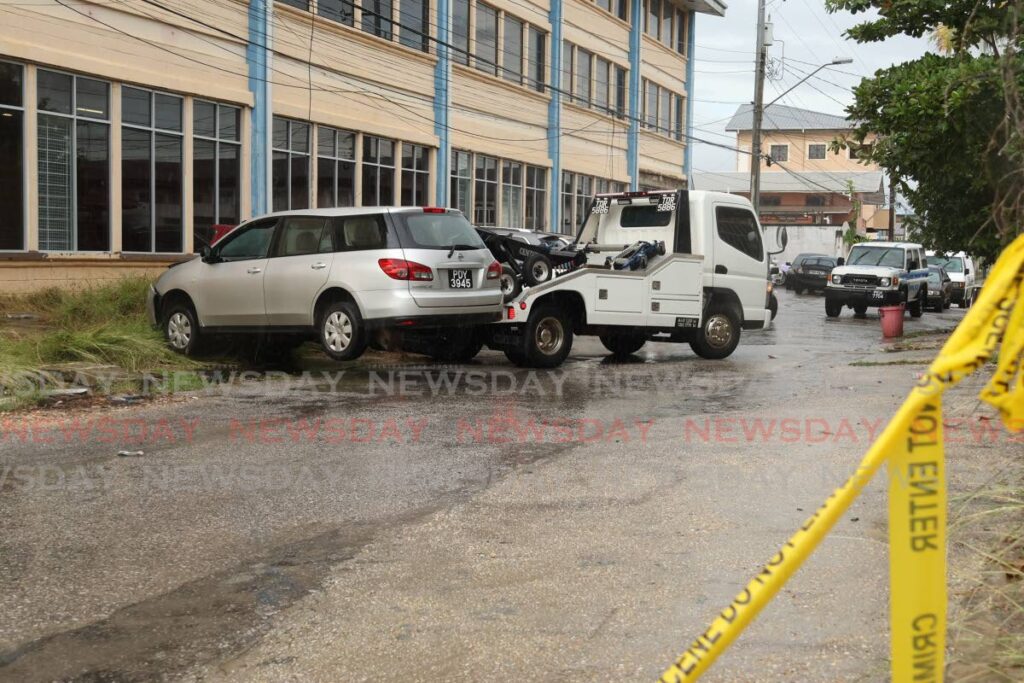 Police wreck a car used by three suspects who allegedly tried to rob the driver of a Blue Waters truck on the Aranguez Main Road near Mangra Trace on November 18. One of the suspects was shot and killed by police, another was injured and the third escaped but was later caught.  - Faith Ayoung