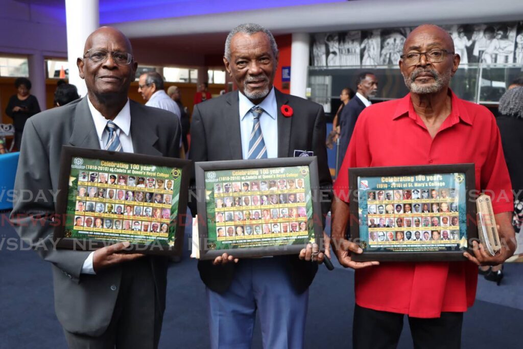 From left, Lieutenant Colonel A.R. Norros Baden-Semper and Colonel Anthony Campbel of the QRC  Cadet Force with Neal White, who received a mural on behalf of his brother Rudy White, at the unveiling ceremony for the Cadet Centennial Photographic Murals (1910-2010) at Queen’s Hall, Port of Spain on November 19. - Photo by Angelo Marcelle
