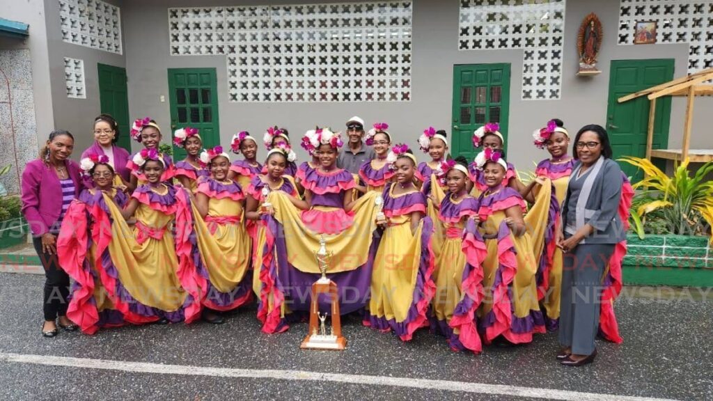 St Gabriel's Girls' parang band with vice principal Danita Howell, at right, and at left is music teacher Lisa Darmanie-De Quinone, next to her is Trisha Matthew De Bique. At the back is Lloyd Gervais, cuatro player from San Jose Serenaders. - Yvonne Webb