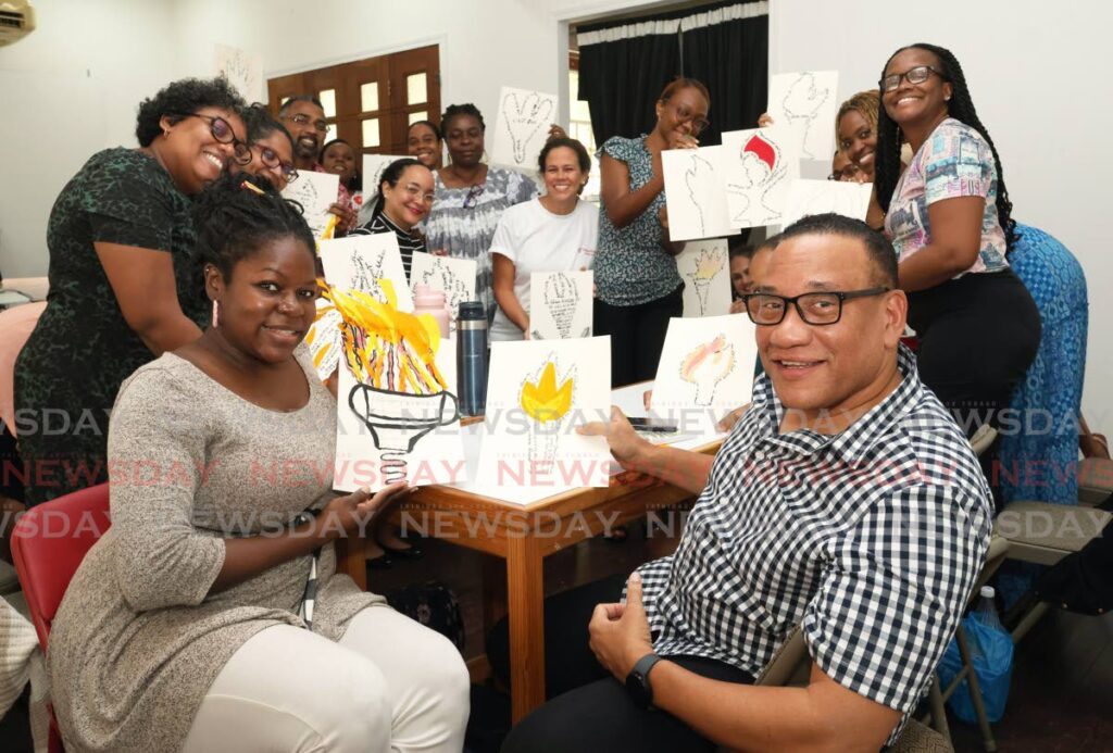 French teachers show off their Torch of Knowledge artwork made for French International Teacher's Day at Alliance Française of Trinidad and Tobago on Alcazar Street, St. Clair, Port of Spain on November 21. - Photo by Faith Ayoung