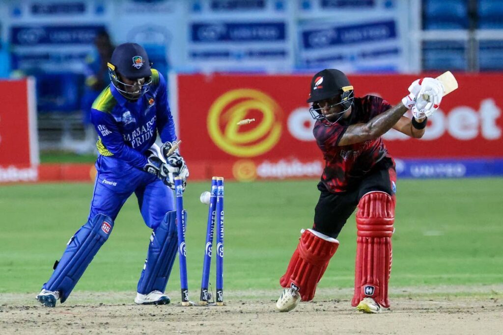 TT Red Force batsman Tion Webster gets bowled during the CWI Super 50 tournament first semifinal against Barbados Pride at Brian Lara Cricket Academy on November 20, in Tarouba. - DANIEL PRENTICE