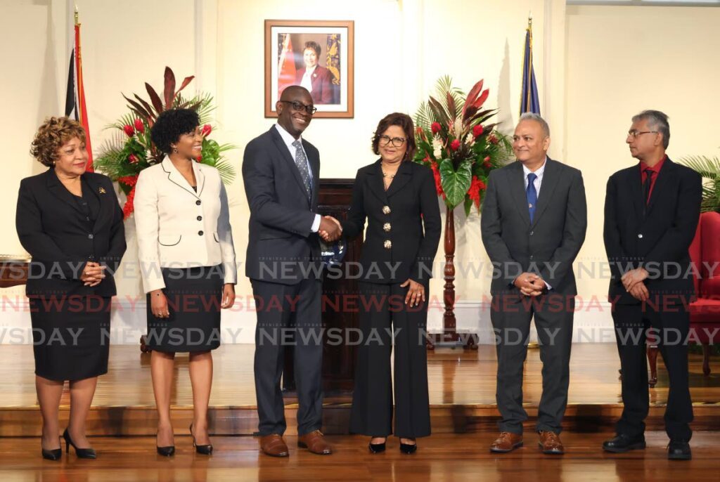 NEW PSC: Newly sworn-in members of the Police Service Commission (PSC) are, from left, Ethel Hector-Berkeley, Annika Fritz-Browne, chairman Wendell Wallace, President Christine Kangaloo, Roger Babooram and reappointed PSC member Ian Kevin Ramdhanie at President's House, St Ann's on Friday. PHOTO BY FAITH AYOUNG - Faith Ayoung