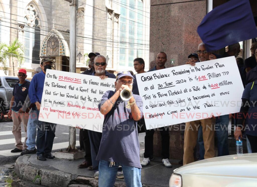 Petrotrin retirees protest about pension plan concerns in front of Republic Bank on Park Street, Port of Spain on November 22. - Photo by Faith Ayoung